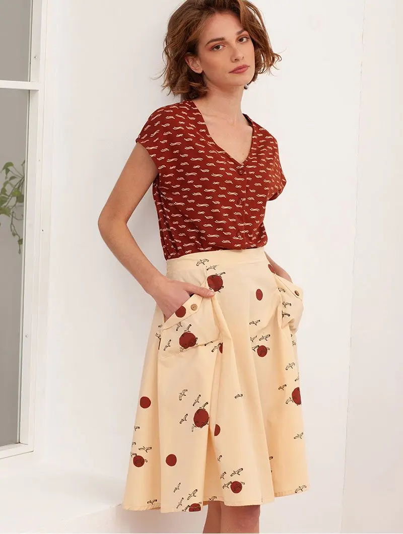 Falda de algodón orgánico beige con pájaros