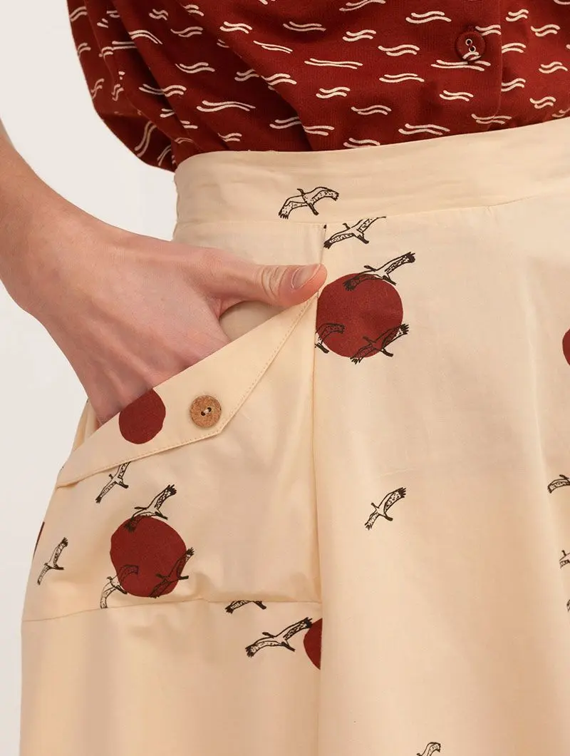Falda de algodón orgánico beige con pájaros